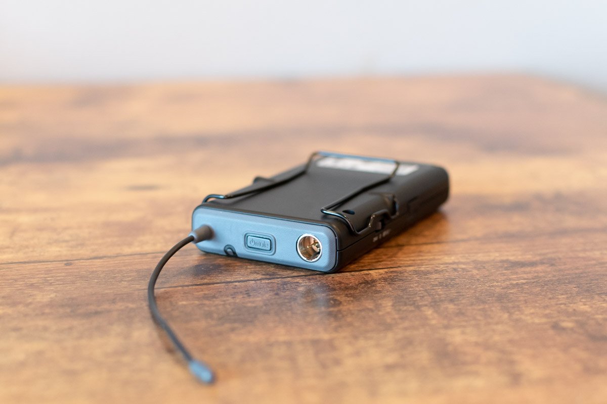 Small electronic device with a cable on a wooden surface
